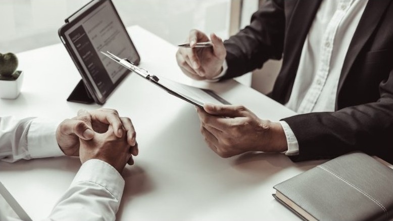 A private investigator reviewing case documentation